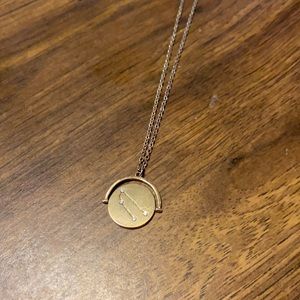 Rotating Taurus zodiac sign necklace